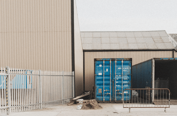 Close-up of an industrial park area with polyurethane lifting foam injected beneath concrete slabs to correct uneven surfaces.