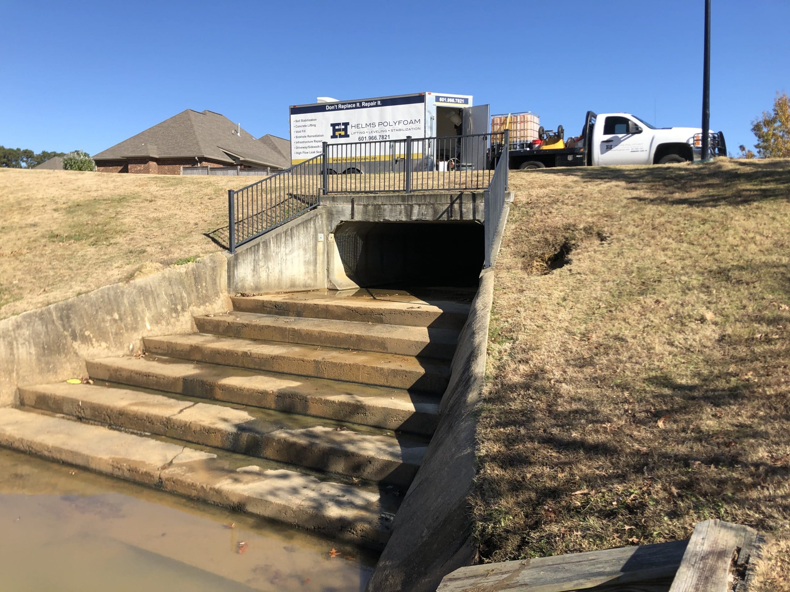 Leak Seal for Drain Culvert with Helms Polyfoam truck in background